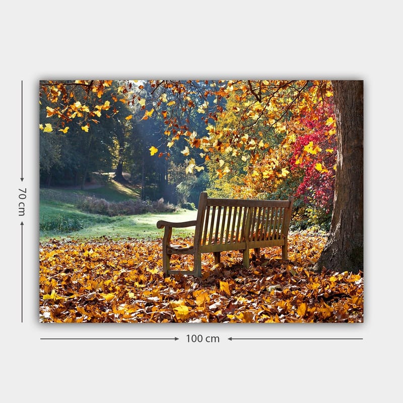 Canvastavla 70x100 cm - Bänk omgiven av färgglada höstlöv i en naturskön miljö - Orange / Gul / Röd - Inredning & dekor - Tavlor & konst - Canvastavla