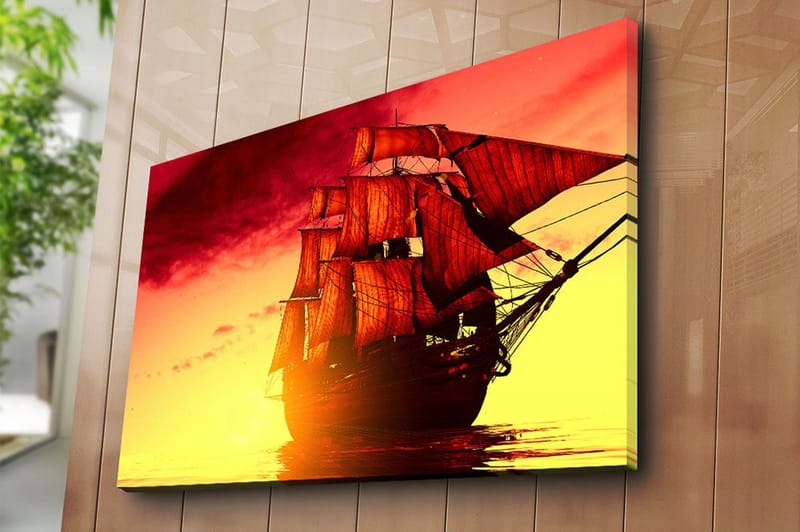Canvastavla 70x100 cm - Ett majestätiskt segelfartyg med röda segel som navigerar genom en gyllene solnedgång - Röd / Orange / Gul - Inredning & dekor - Tavlor & konst - Canvastavla