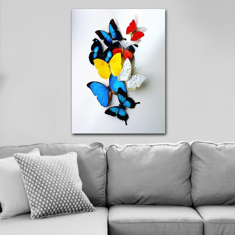 Canvastavla 70x100 cm - Färgglad samling av fjärilar i olika nyanser som skapar en livfull och dynamisk komposition - Blå / Gul / Röd - Inredning & dekor - Tavlor & konst - Canvastavla