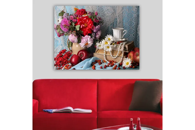 Canvastavla 70x100 cm - Färgglad stilleben med blommor, frukter och en kopp på en bokstapel, Röd / Grön / Lila