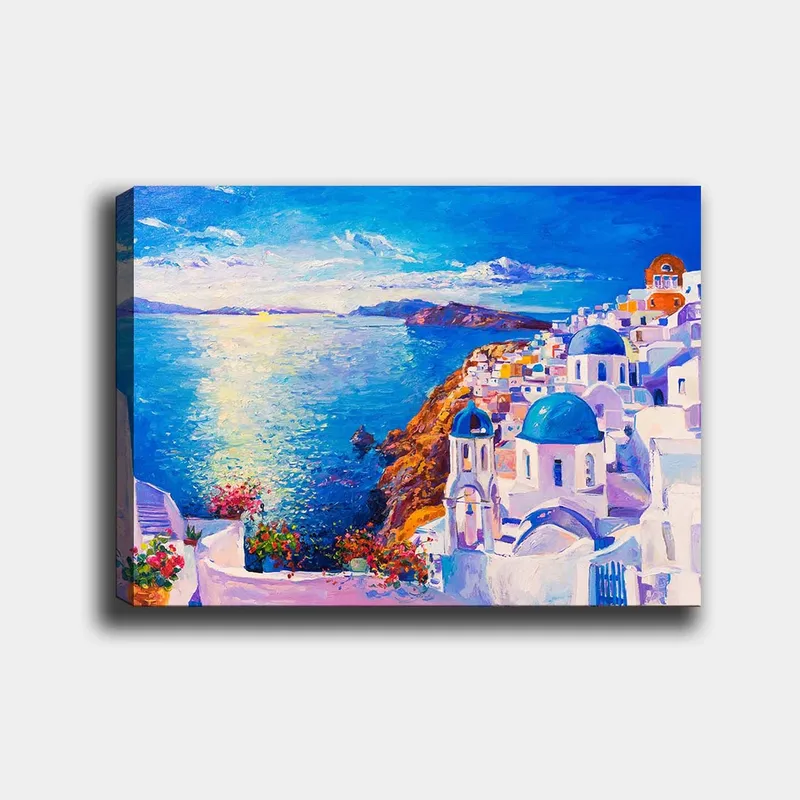 Canvastavla 70x100 cm - Färgstark vy över en grekisk kuststad med vita byggnader och blå kupoler som sträcker sig mot havet, Blå / Vit / Orange