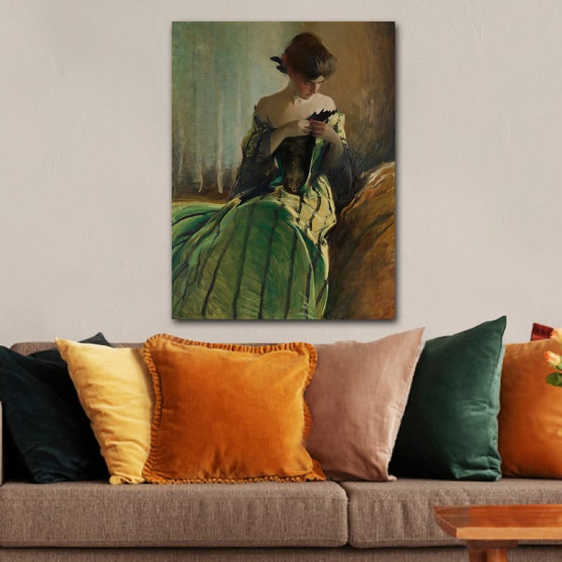 Canvastavla 70x100 cm - Kvinna i en grön klänning sitter och arbetar med något i händerna, djupt försjunken i sina tankar - Grön / Svart / Beige - Inredning & dekor - Tavlor & konst - Canvastavla