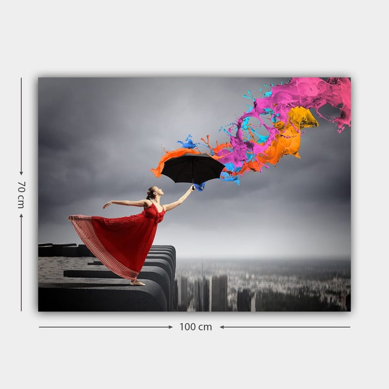 Canvastavla 70x100 cm - Kvinna i röd klänning står på en kant och håller ett paraply, medan färgglada färgstrålar sprutar ut från det - Röd / Svart / Orange - Inredning & dekor - Tavlor & konst - Canvastavla