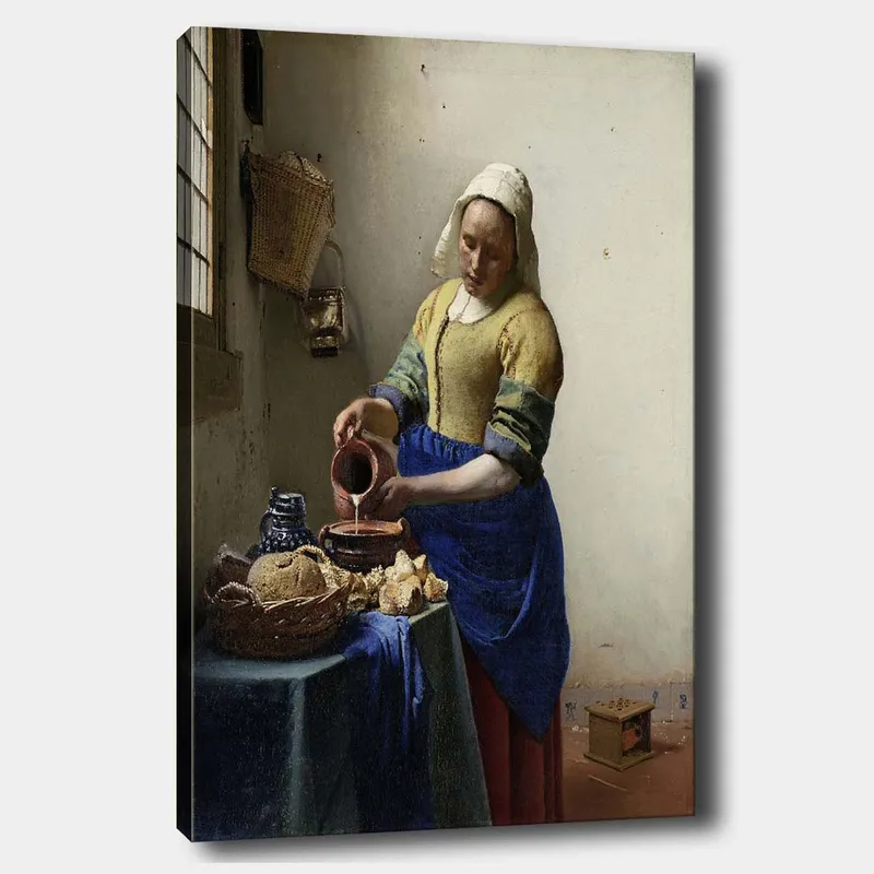 Canvastavla 70x100 cm - Kvinna som häller mjölk i en skål i ett ljust kök, Blå / Gul / Brun