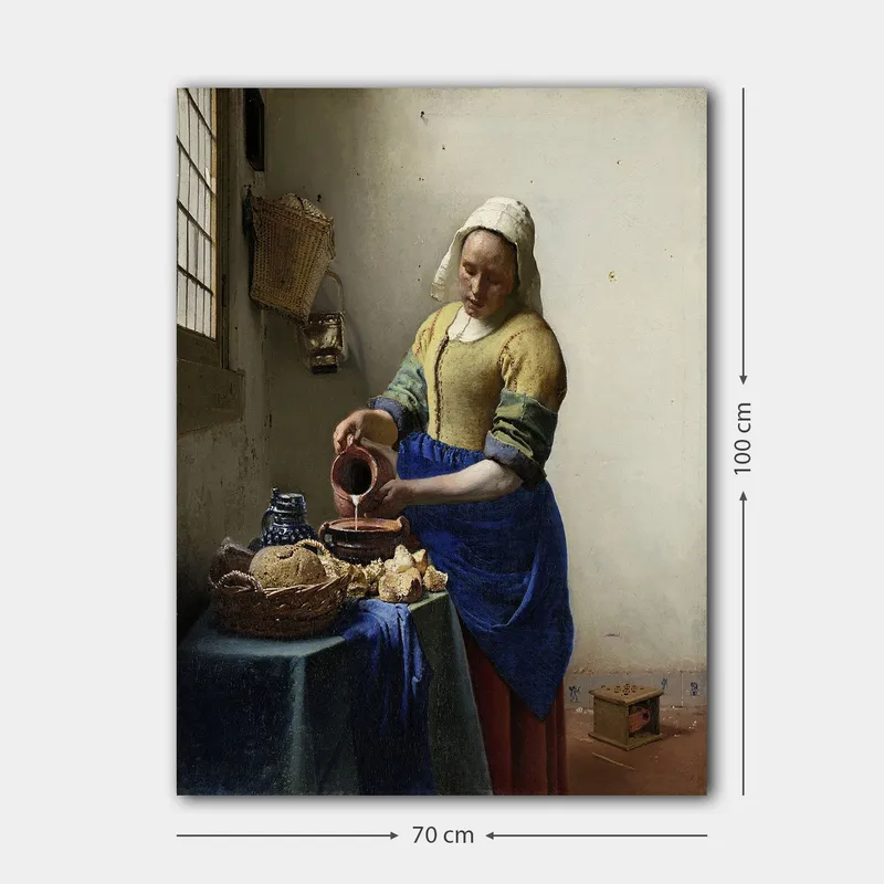 Canvastavla 70x100 cm - Kvinna som häller mjölk i en skål i ett ljust kök - Blå / Gul / Brun - Inredning & dekor - Tavlor & konst - Canvastavla