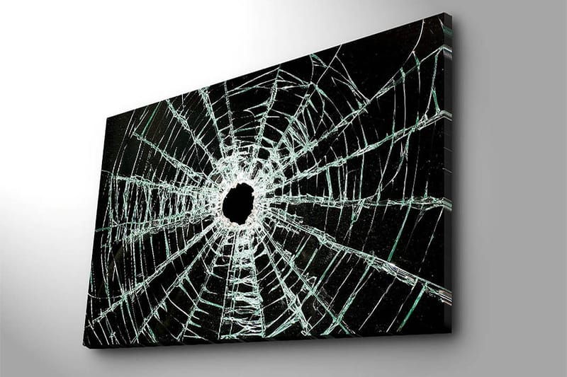Canvastavla 70x100 cm - Närbild av en sprucken glasruta med ett centralt hål och sprickor som sträcker sig utåt - Svart / Genomskinlig - Inredning & dekor - Tavlor & konst - Canvastavla