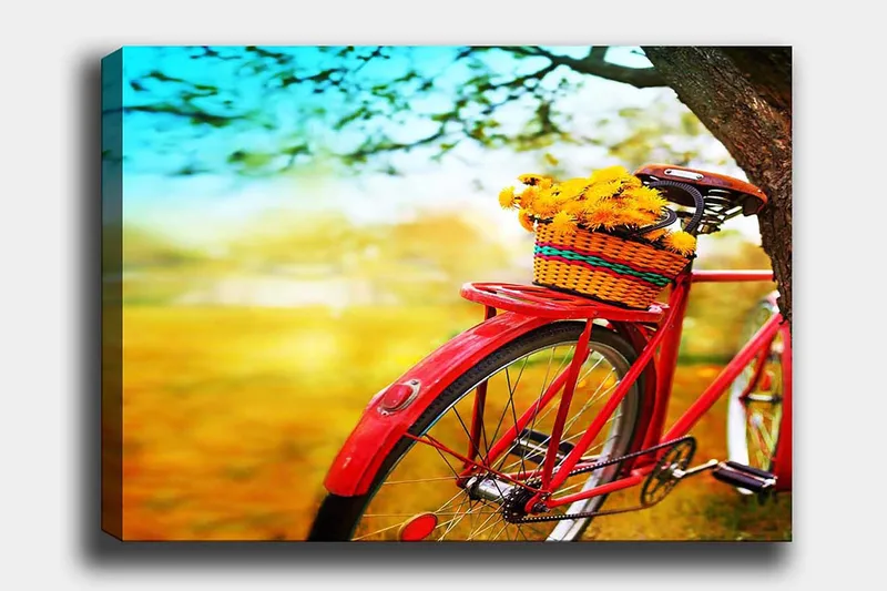 Canvastavla 70x100 cm - Röd cykel med en korg fylld av gula blommor, Röd / Gul / Grön