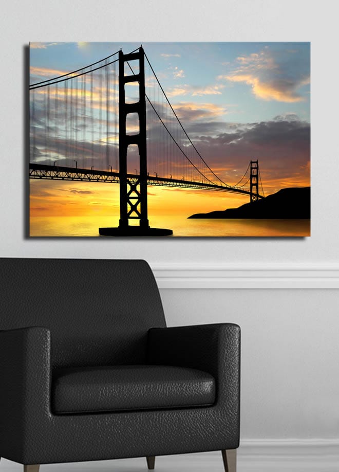 Canvastavla 70x100 cm - Silhuett av en bro mot en färgsprakande solnedgång - Orange / Svart / Blå - Inredning & dekor - Tavlor & konst - Canvastavla