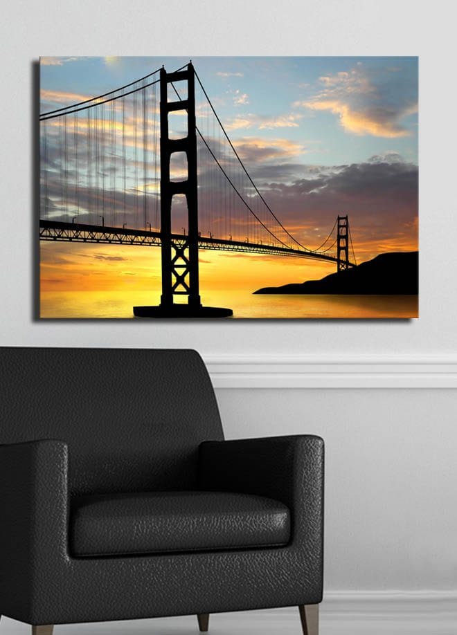 Canvastavla 70x100 cm - Silhuett av en bro mot en färgsprakande solnedgång - Orange / Svart / Blå - Inredning & dekor - Tavlor & konst - Canvastavla