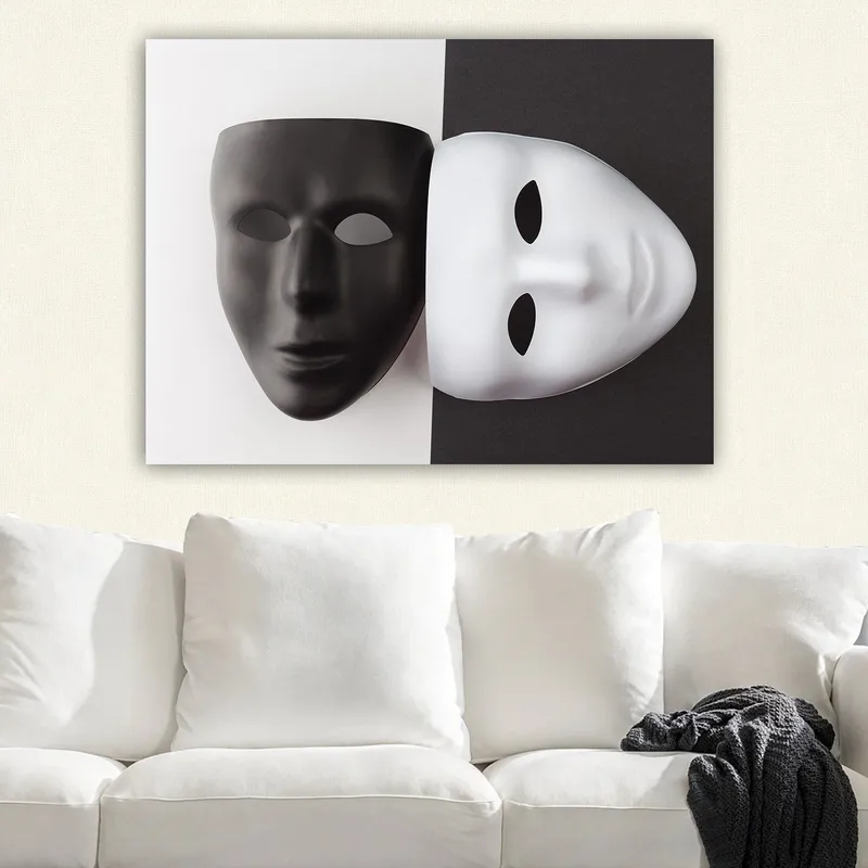 Canvastavla 70x100 cm - Två masker, en svart och en vit, som symboliserar kontrasterande känslor eller identiteter, Svart / Vit