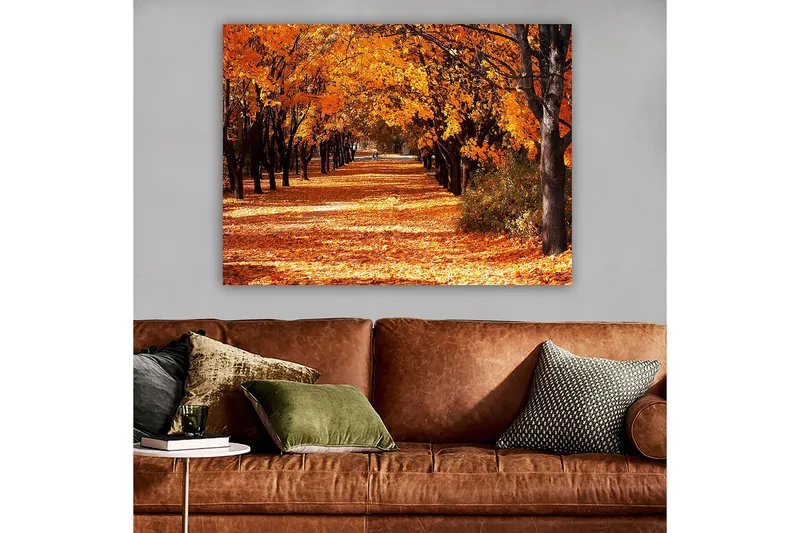 Canvastavla 70x100 cm - Vacker höstscen med träd i starka orangea och gula nyanser som skapar en inbjudande gångväg täckt av fallna löv - Orange / Gult / Brunt - Inredning & dekor - Tavlor & konst - Canvastavla