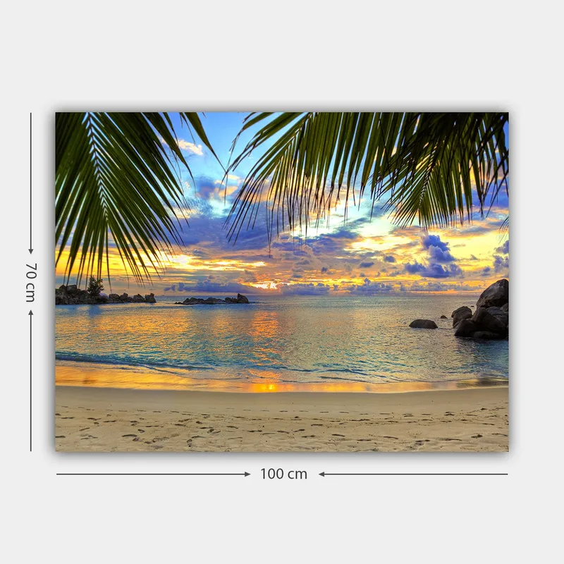 Canvastavla 70x100 cm - Vacker solnedgång över en strand med palmer som ramar in motivet - Blå / Orange / Grön - Inredning & dekor - Tavlor & konst - Canvastavla