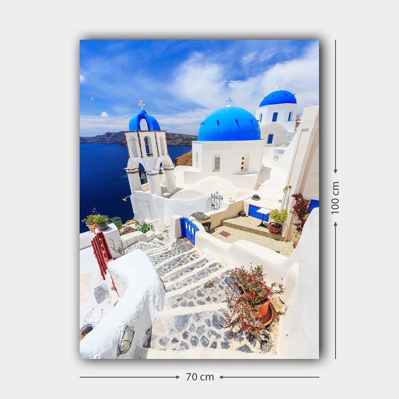Canvastavla 70x100 cm - Pittoresk vy av vita hus med blå kupoler och en stenlagd väg i en grekisk ö-miljö - Blå / Vit - Inredning & dekor - Tavlor & konst - Canvastavla