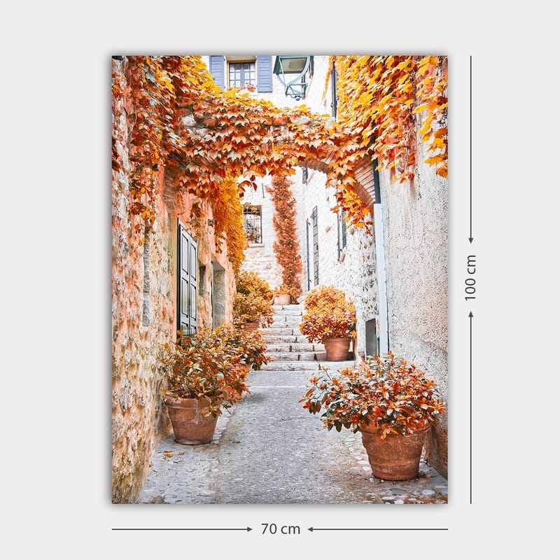 Canvastavla 70x100 cm - Pittoresk gränd omgiven av färgglada höstlöv och krukväxter - Orange / Brunt / Gult - Inredning & dekor - Tavlor & konst - Canvastavla