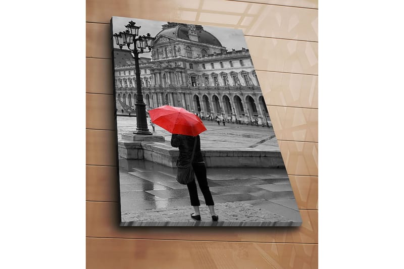 Canvastavla 70x100 cm - Person står med ett rött paraply i en regnig stadsmiljö framför en historisk byggnad - Röd / Svart - Inredning & dekor - Tavlor & konst - Canvastavla
