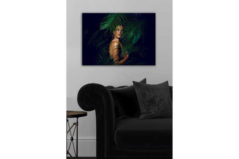 Canvastavla - Kvinna delvis dold bakom gröna palmblad - Mörkgrön / Hudton / Svart - Inredning & dekor - Tavlor & konst - Canvastavla