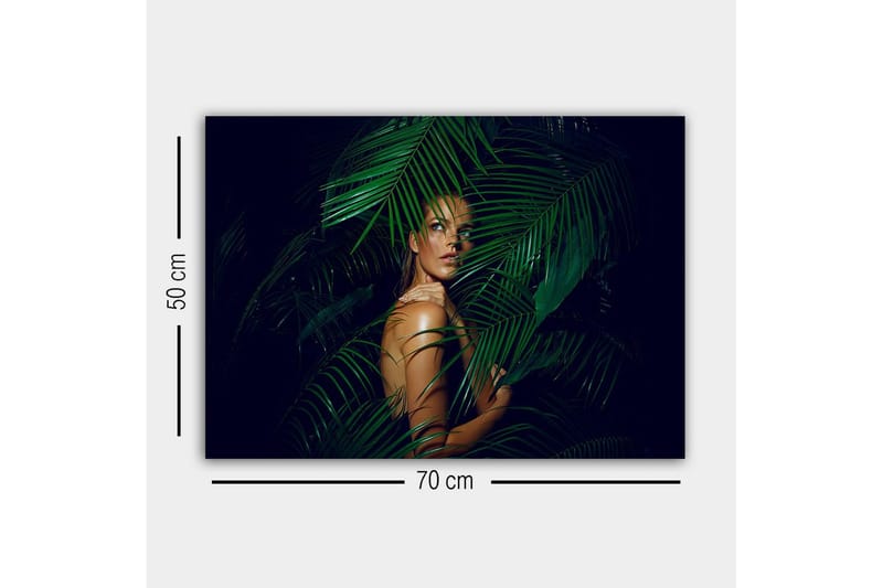 Canvastavla - Kvinna delvis dold bakom gröna palmblad - Mörkgrön / Hudton / Svart - Inredning & dekor - Tavlor & konst - Canvastavla