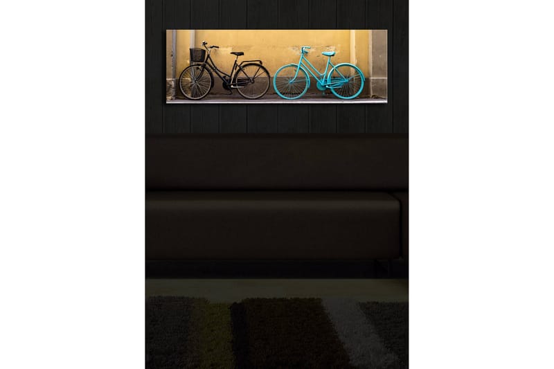 Canvastavla med LED-belysning 30x90 cm - Cyklar i kontrasterande färger mot en gul vägg - Svart / Turkos / Gul - Inredning & dekor - Tavlor & konst - Canvastavla