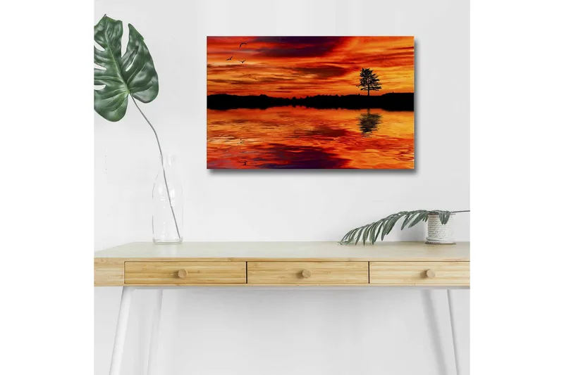 Canvastavla med LED-belysning - Solnedgång över stilla vatten med silhouett av ett ensamt träd, Orange / Röd / Svart