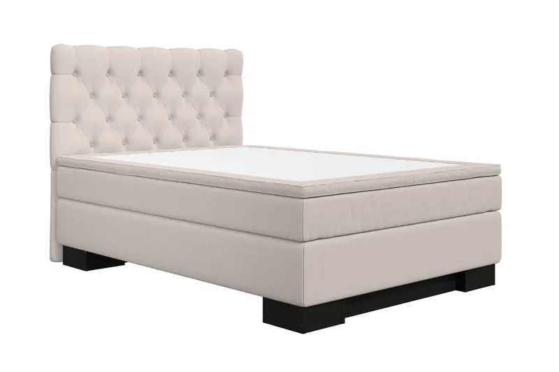 Fernando Mendoza, a Mexican‑American, in a modern bedroom featuring a beige continental bed